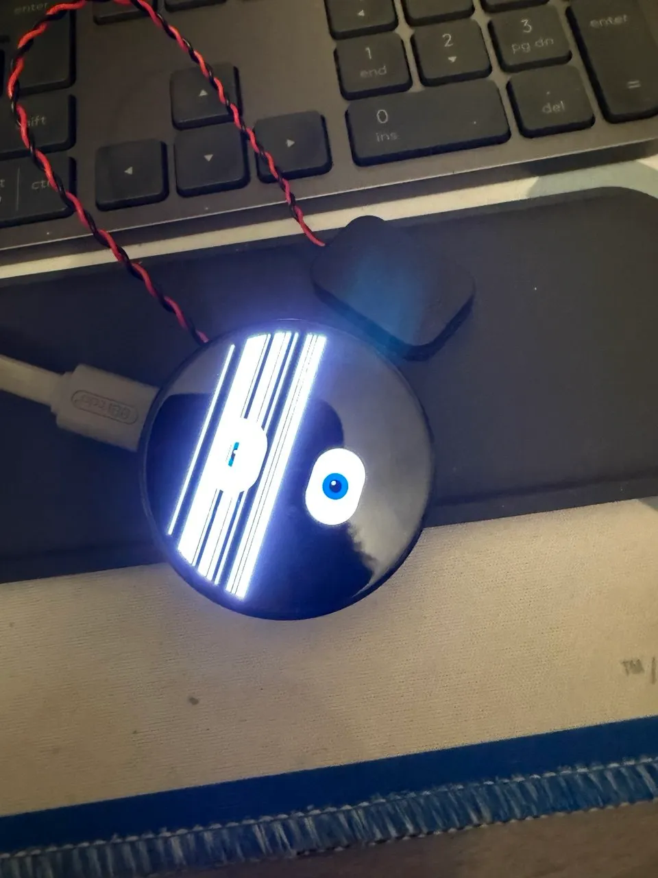 Kai's damaged screen - one eye still visible, the other side a mess of white lines
